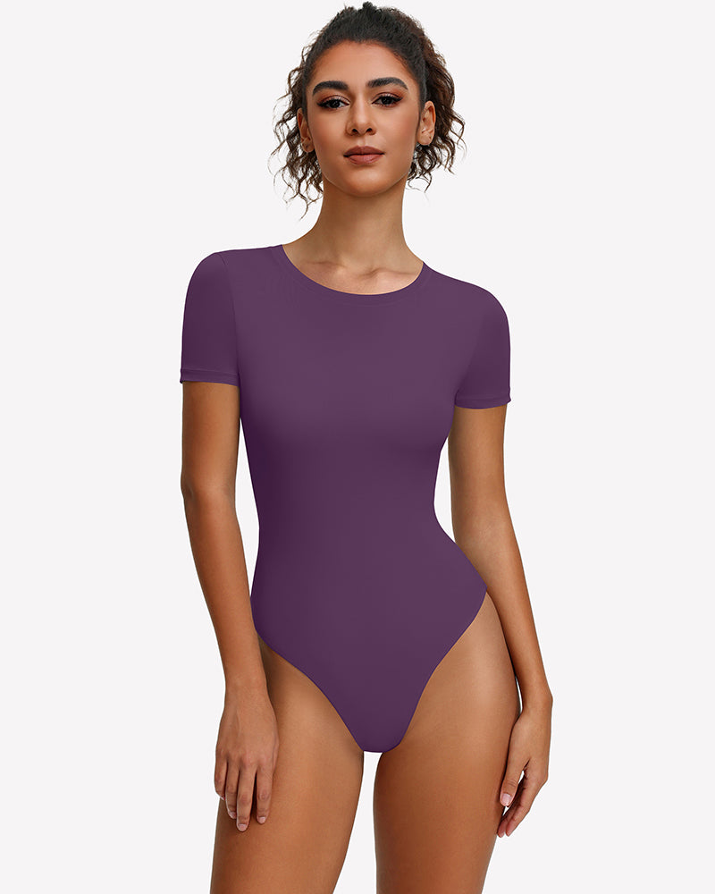 Purple short-sleeve snap bodysuit, fitted one-piece leotard top.