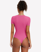 Pink short sleeve snap bodysuit one-piece leotard, back view