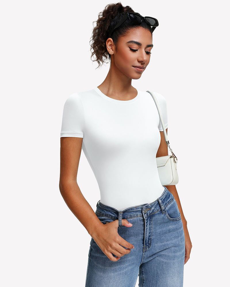 White short sleeve snap bodysuit one-piece leotard with round crew neck, worn with jeans