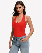 Red halter bodysuit with deep scoop neckline, worn with blue jeans