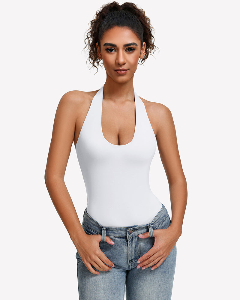 White halter bodysuit with deep scoop neckline, worn with blue jeans