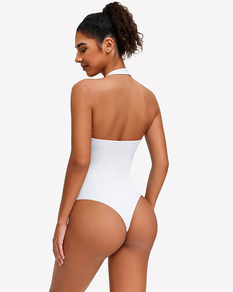 White halter bodysuit with low open back and high-cut leg coverage