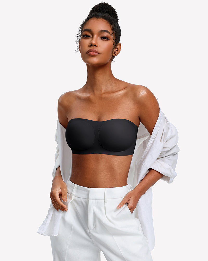 Strapless wireless bra in black with smooth molded cups, worn under an open shirt