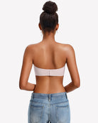 Back view of a strapless wireless bra in white with a center back seam