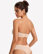 Back view of a strapless wireless bra in nude-beige with a center back seam