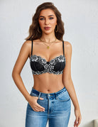 Black balconette bra with white floral lace trim and underwire cups