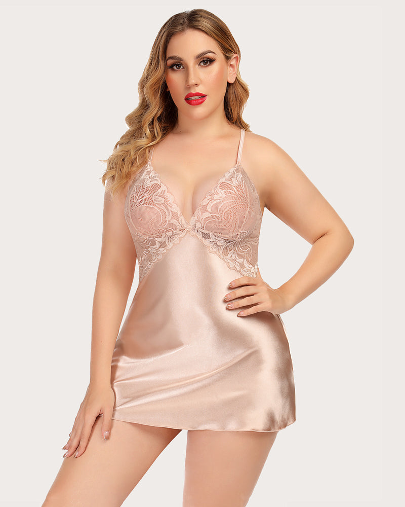 Plus-size model in blush pink satin nightdress with lace V-neck, adjustable straps. Sexy lingerie.