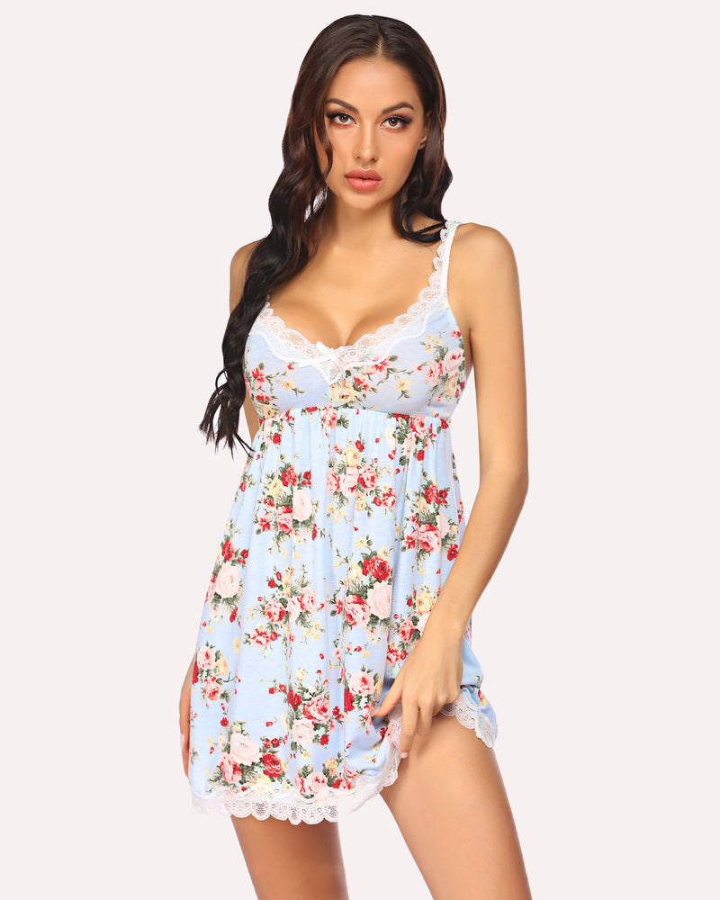 Floral mini slip dress in light blue with lace trim and spaghetti straps for confident women.