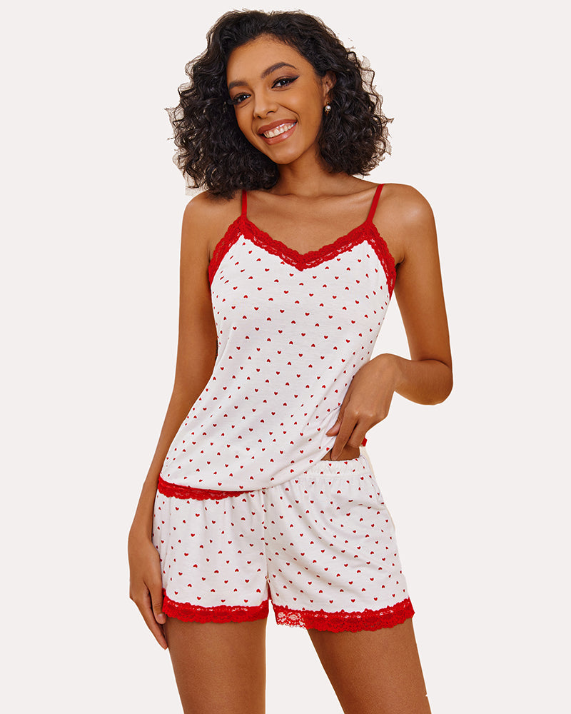 Heart print cami pajama set with red lace, modeled. Comfortable and sexy sleepwear for women.