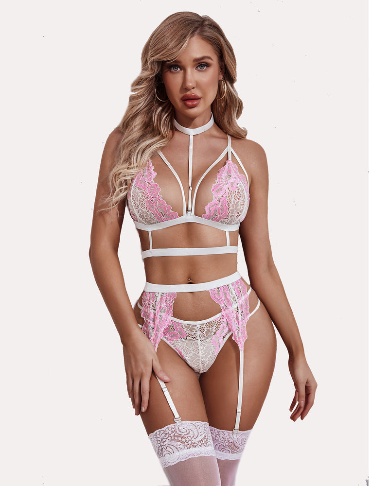 White and pink lace lingerie set with strappy bra, suspender belt, and choker. Delicate lace design.