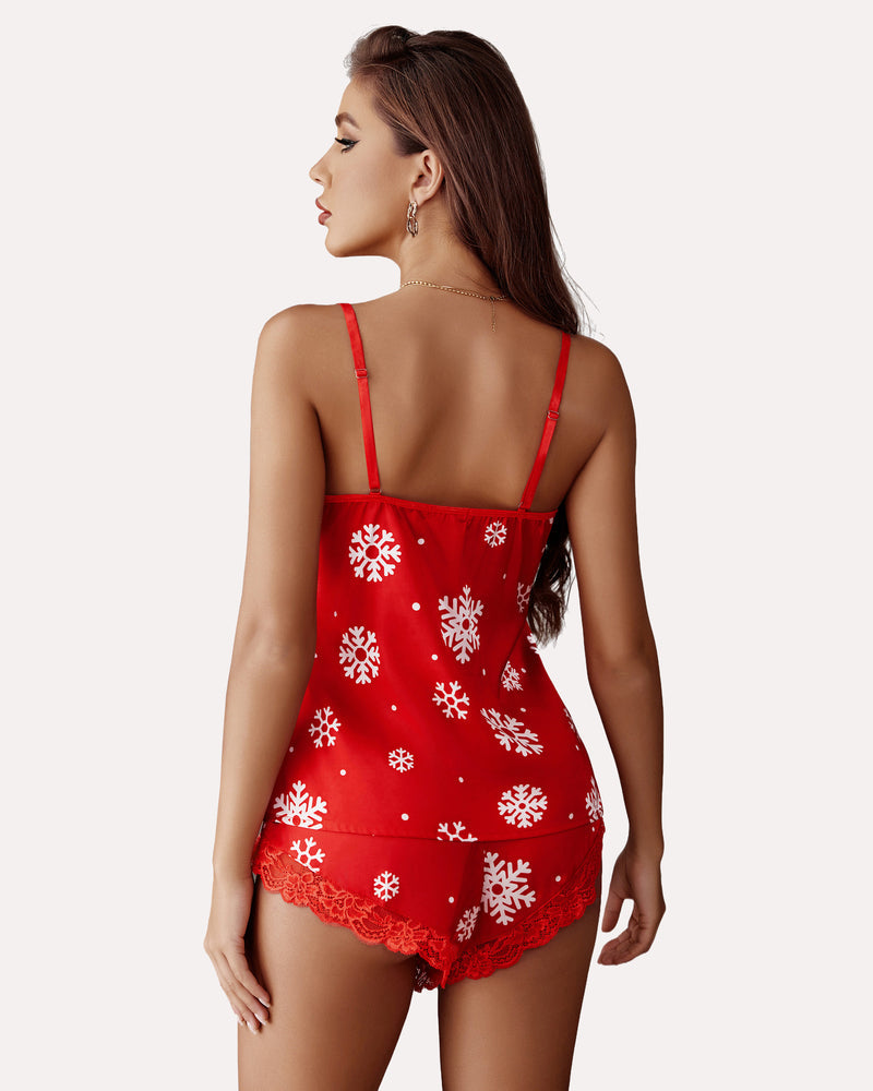Red Christmas pajama set with snowflake print and lace trim. Women's holiday sleepwear.