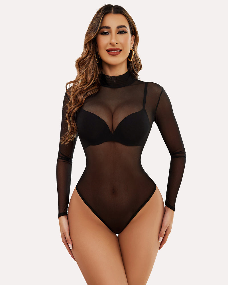 Black sheer mesh bodysuit with spiderweb design and long sleeves styled with jeans.