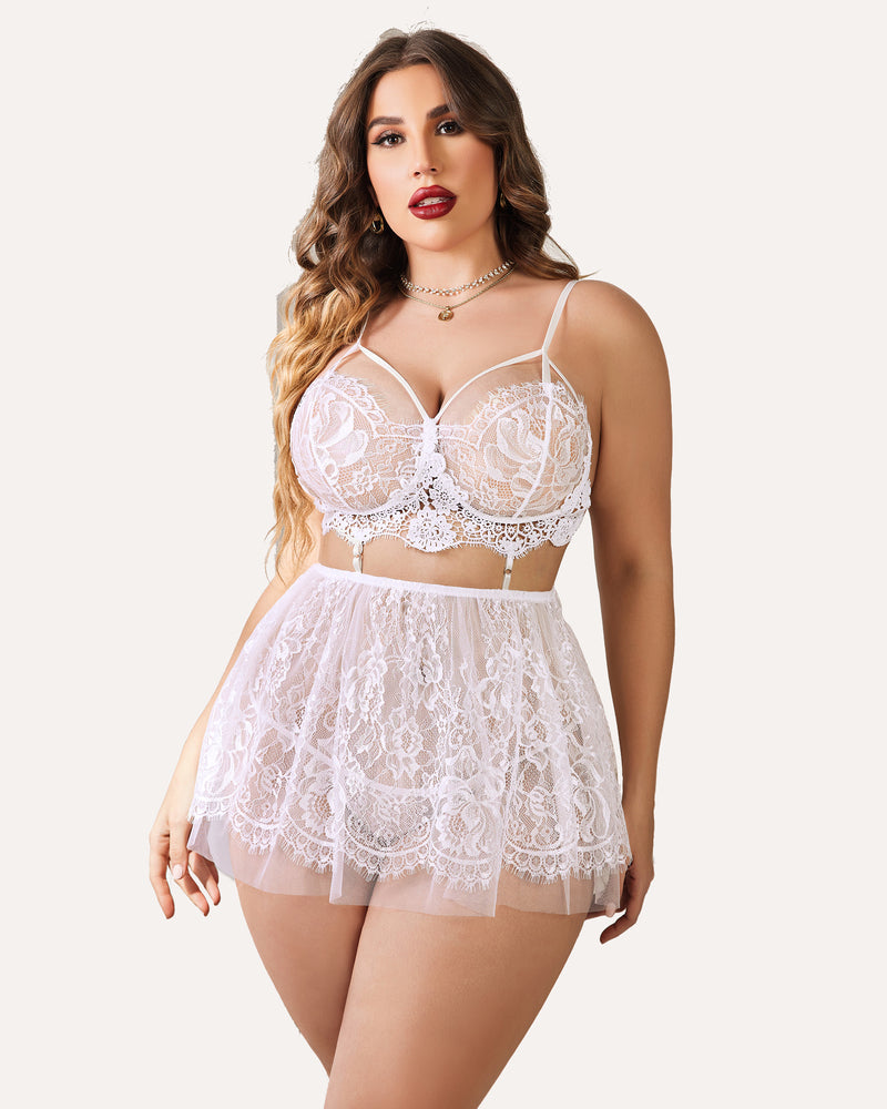 Plus size white lace babydoll lingerie set featuring a strappy bralette and sheer skirt