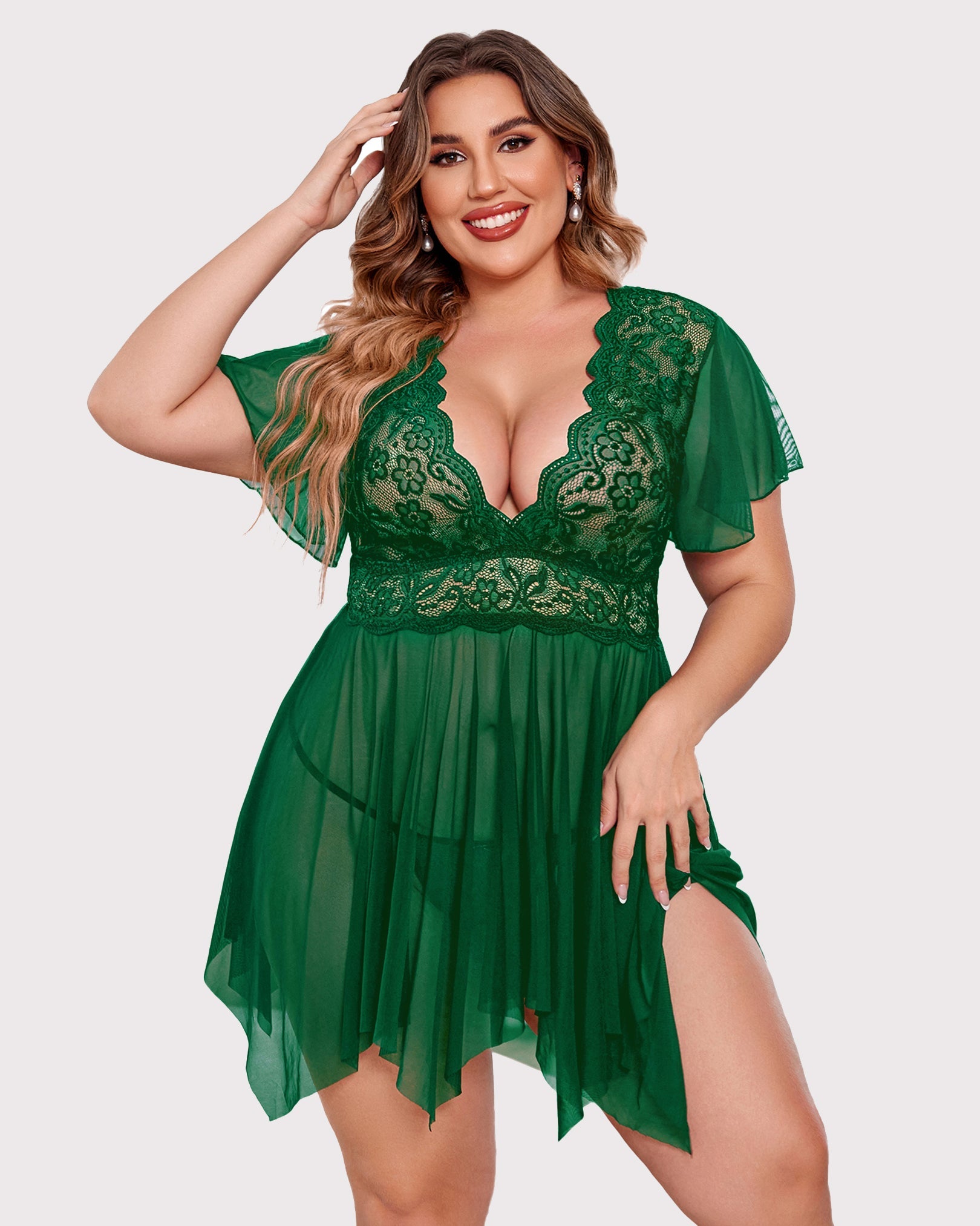 Plus size green babydoll lingerie with floral lace, deep V-neck and asymmetrical hem.