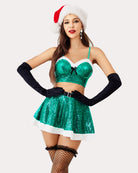 Sparkling green Santa lingerie set with black gloves and festive accessories.