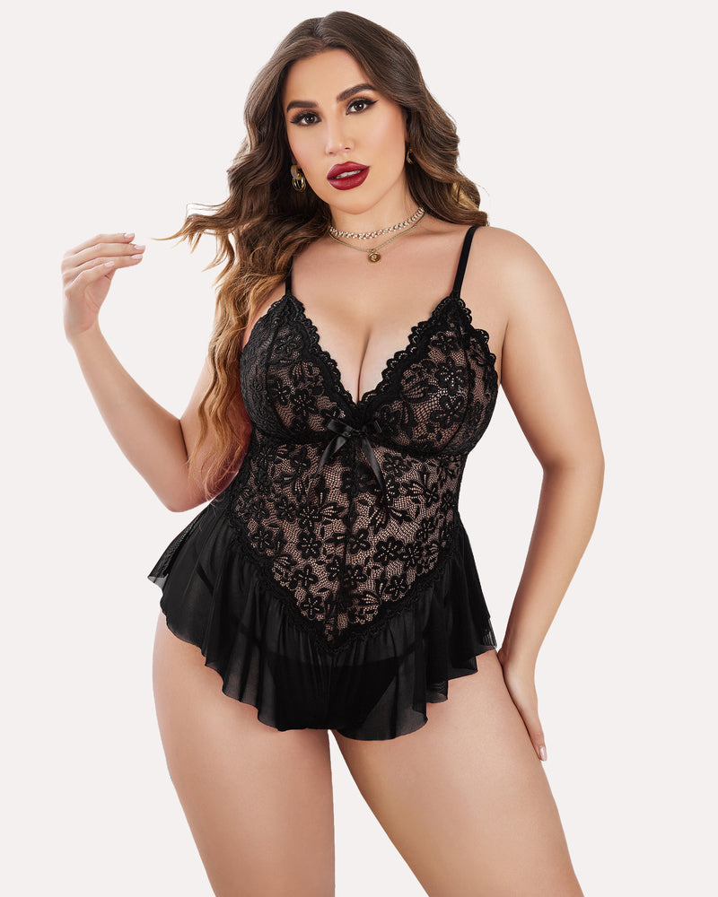 Plus size pink lace teddy featuring floral design and flowing hem, showcasing adjustable straps.