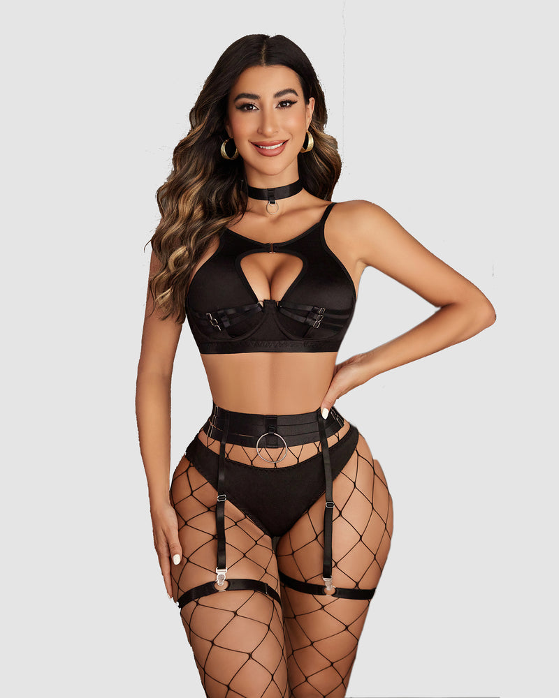 Black push-up lingerie set with cut-out bra, garter belt, and fishnet stockings. Sensual lingerie.