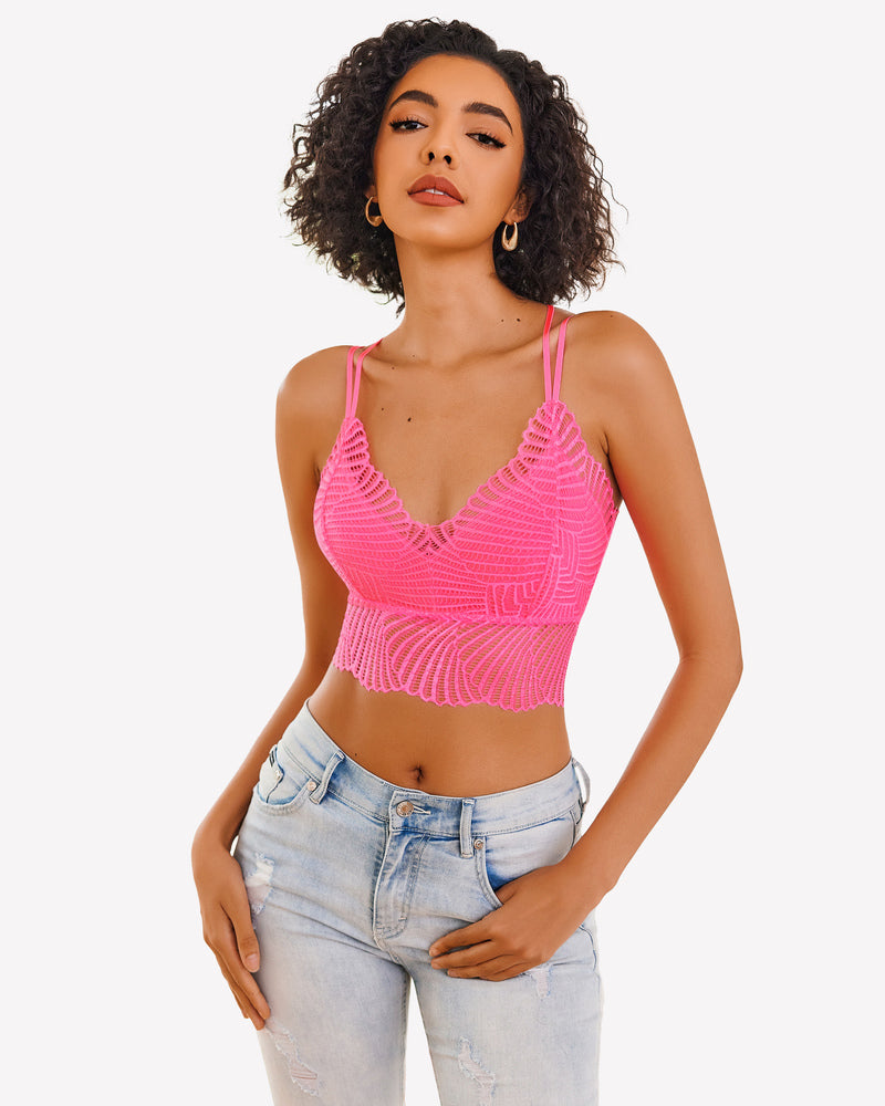 Pink lace V-neck crop top by Avidlove. Adjustable straps and scalloped edge design. Model in jeans.