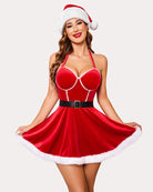 Green Santa-inspired halter neck babydoll dress with white fur trim and black belt.