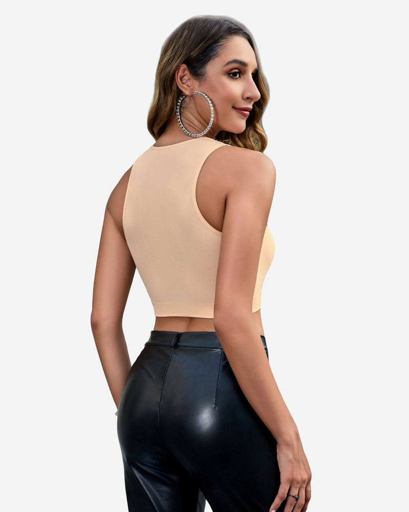 Beige crop top with black leather pants. Chic and fashionable for women.
