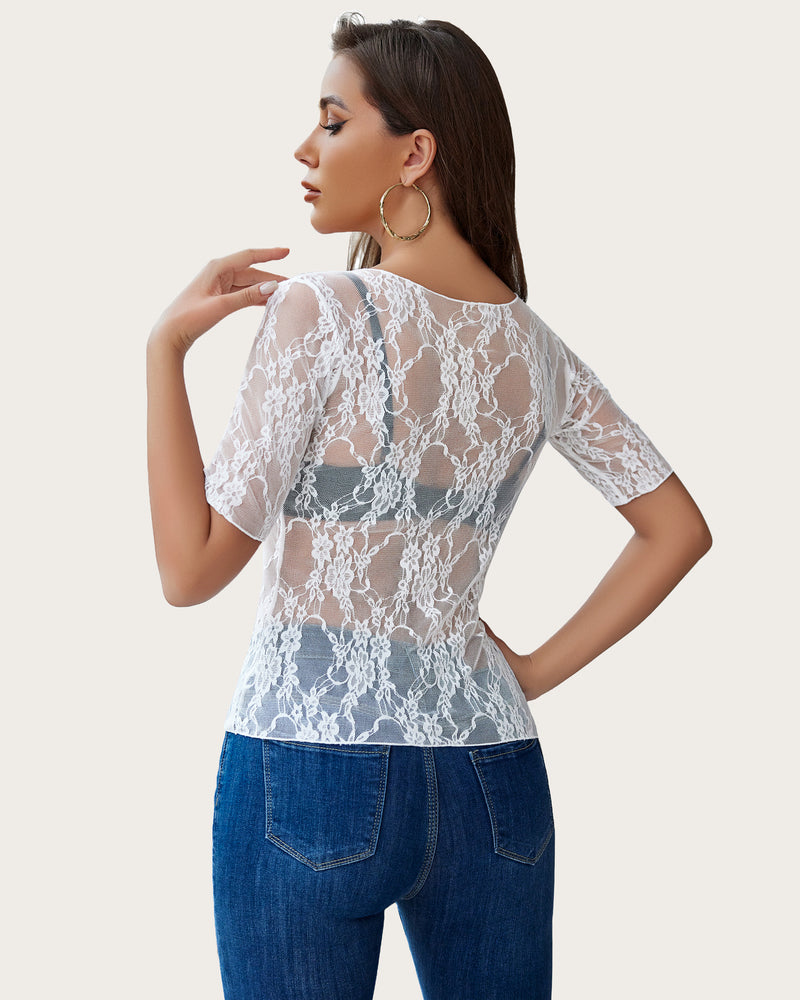 White floral lace mesh short sleeve top with blue jeans. Confident, sexy style.