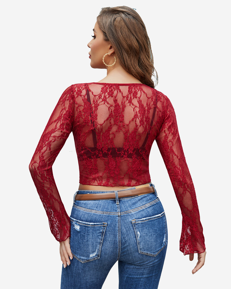 Burgundy floral lace sheer top with bell sleeves and blue jeans. Classy and elegant style.