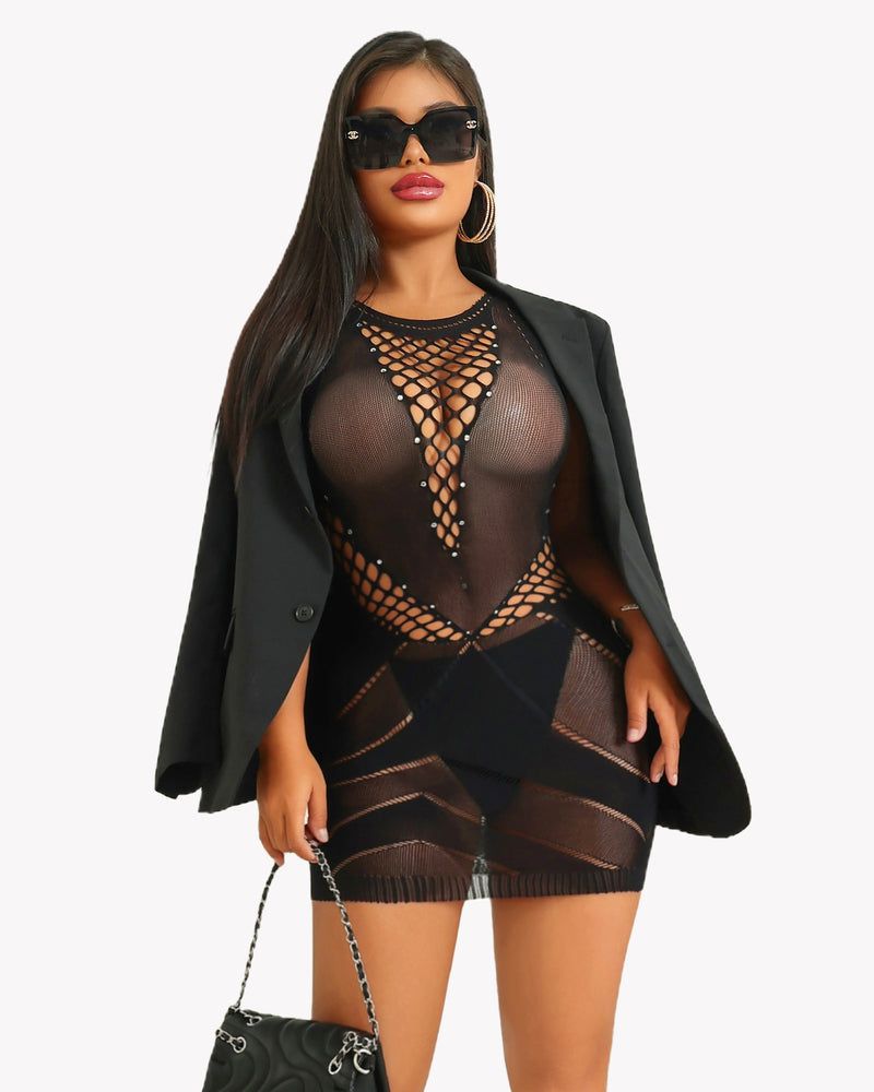 Black fishnet dress with rhinestone details, paired with blazer and accessories.