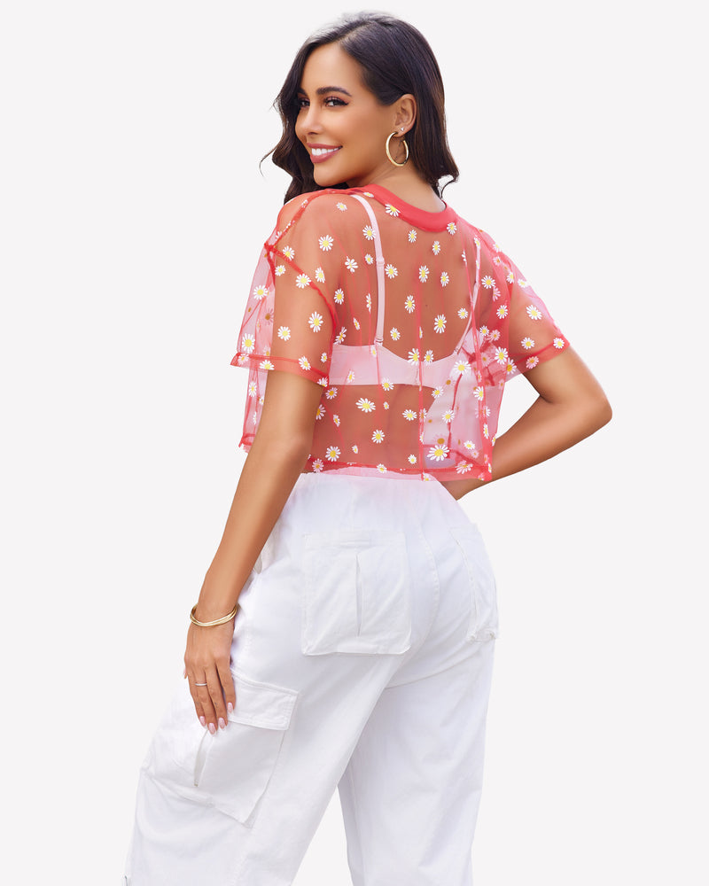 Red daisy mesh crop top paired with white pants. Trendy and sexy see-through shirt for women.