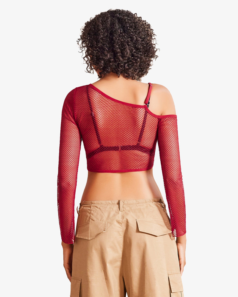 Red fishnet asymmetrical crop top, see-through design, with bra and cargo pants, for a sexy look