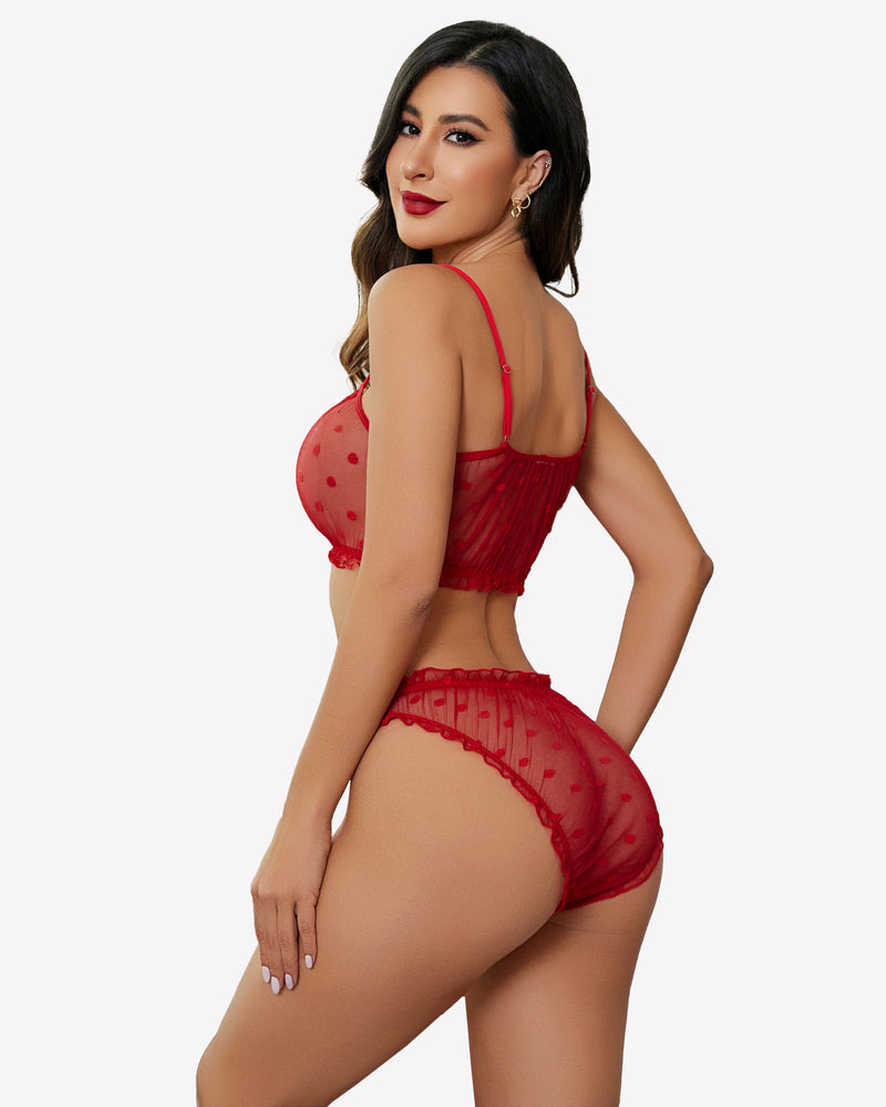 Red mesh lingerie bra and panty set with polka dots and ruffle details, showing a confident woman.