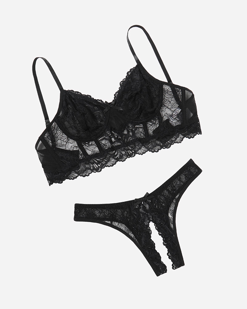Black lace bra and crotchless panty set with bow details, offering a flattering and sexy look.