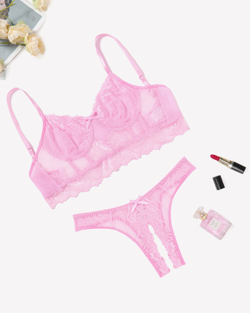 Pink lace lingerie set with bra and crotchless panty, offering a flattering and sexy look.