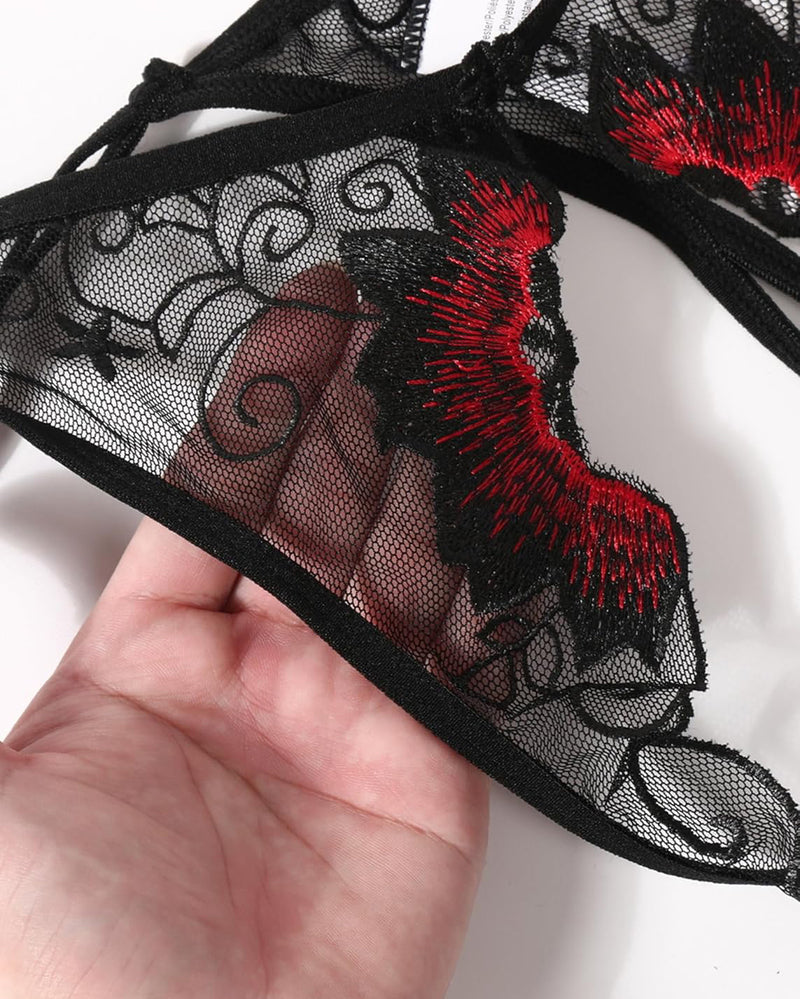 Black floral embroidered thong panties with red accents. Low rise design, sexy lingerie for women.