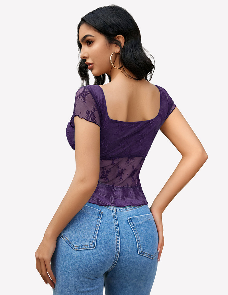 Purple lace mesh floral shirt with square neckline and blue jeans, back view.