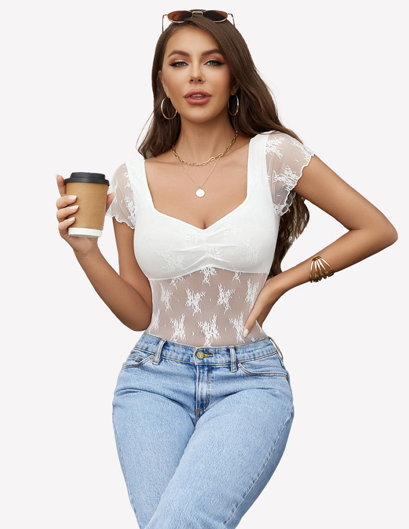 Lace mesh floral shirt with square neckline and blue jeans. Elegant and fashionable.