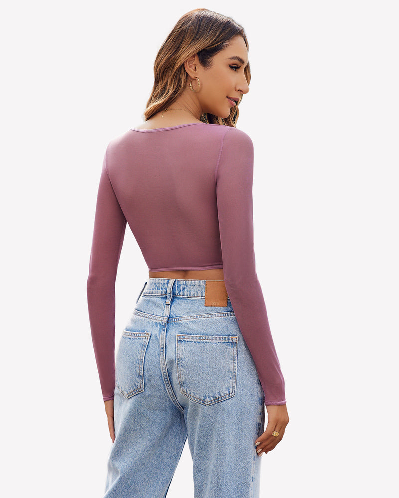 Mauve long sleeve sheer crop top with light blue jeans, perfect for a sexy and comfortable look.