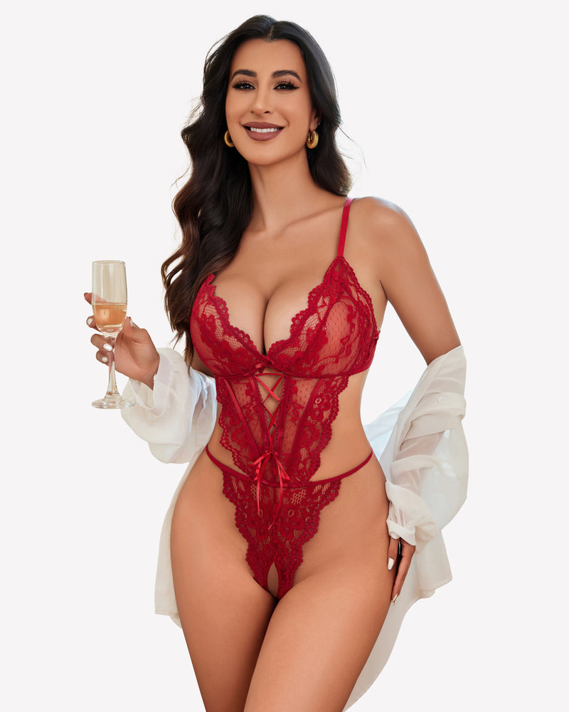 Red lace teddy lingerie with adjustable straps, a confident woman holding champagne.