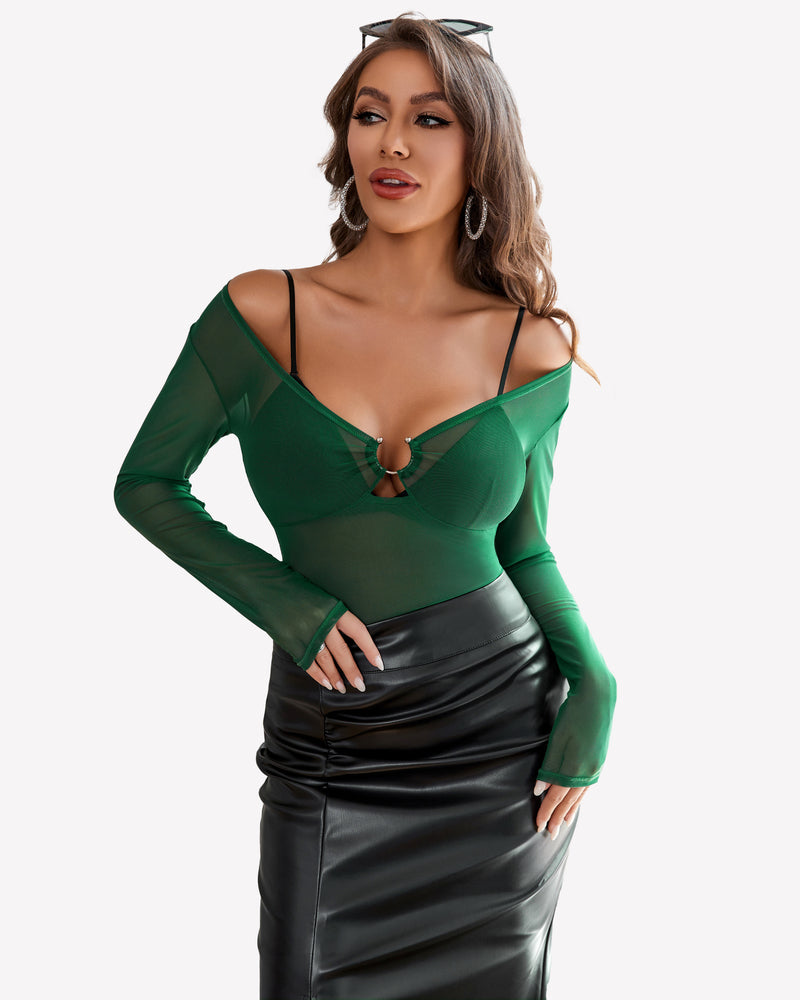 Mesh long sleeve blouse with ring detail, off-shoulder, green; paired with black skirt.
