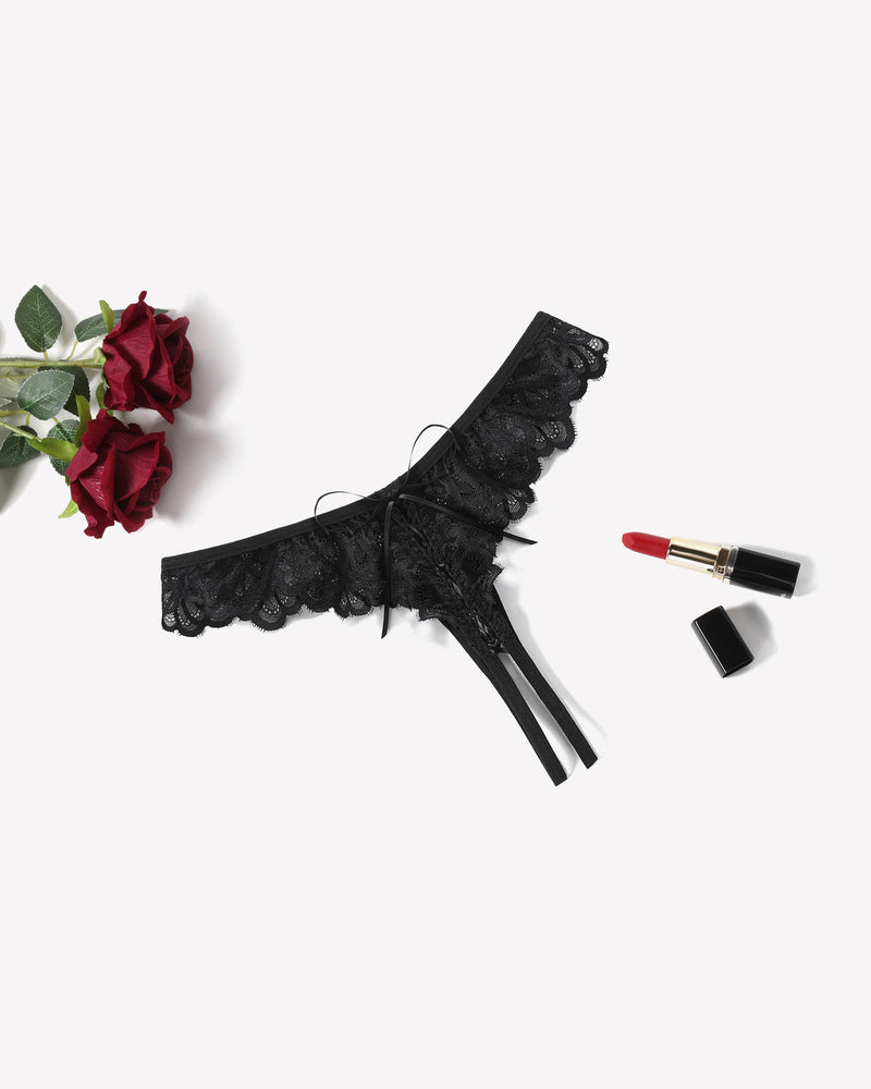 Black lace thong briefs with criss-cross design and bow, perfect for special occasions