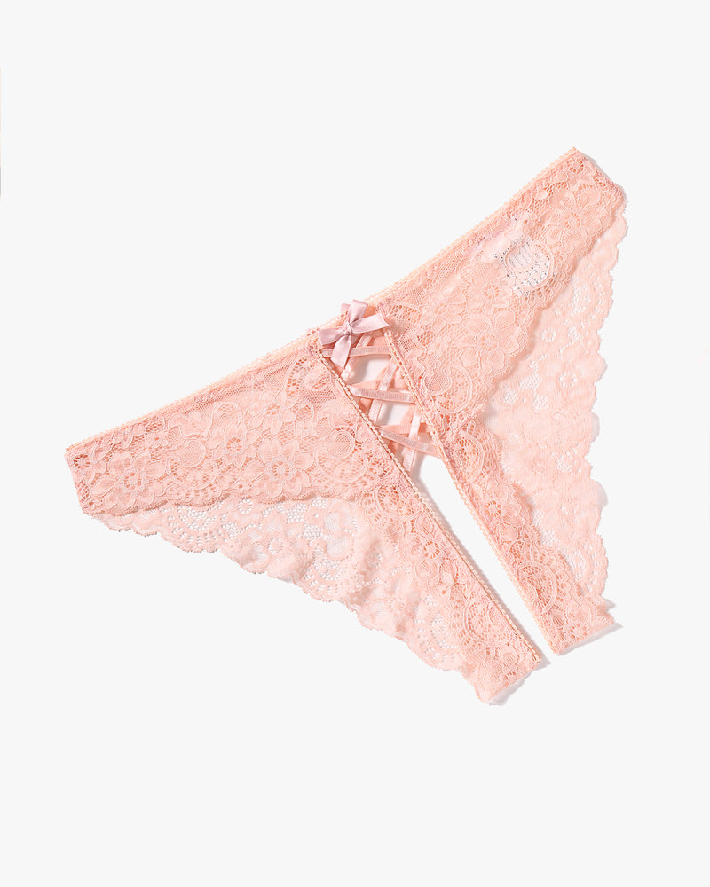 Peach lace hipster panty with criss-cross straps and bow detail. Delicate floral lace design.