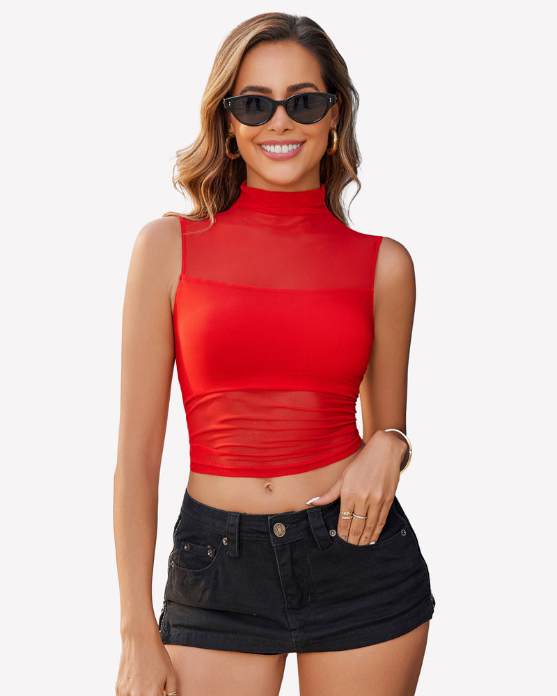 Red mesh mock neck crop top with black denim shorts, a stylish and confident look.