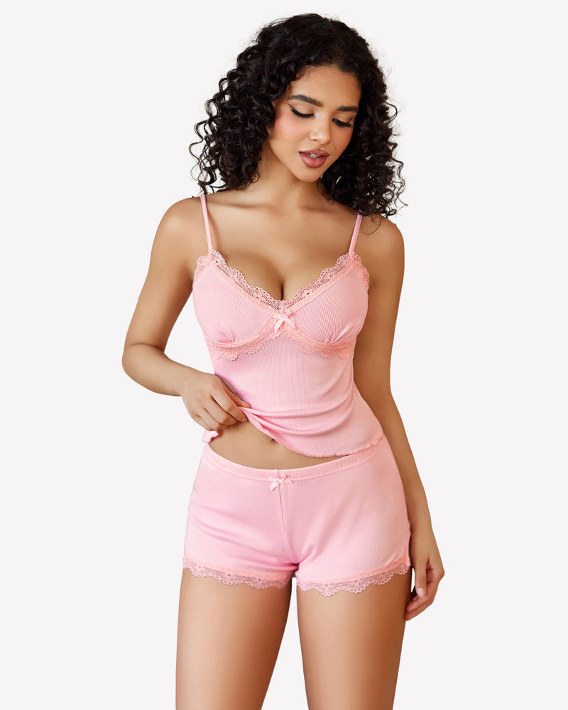 Pink cami pajama set with lace trim, soft and comfortable, perfect for a relaxing night.