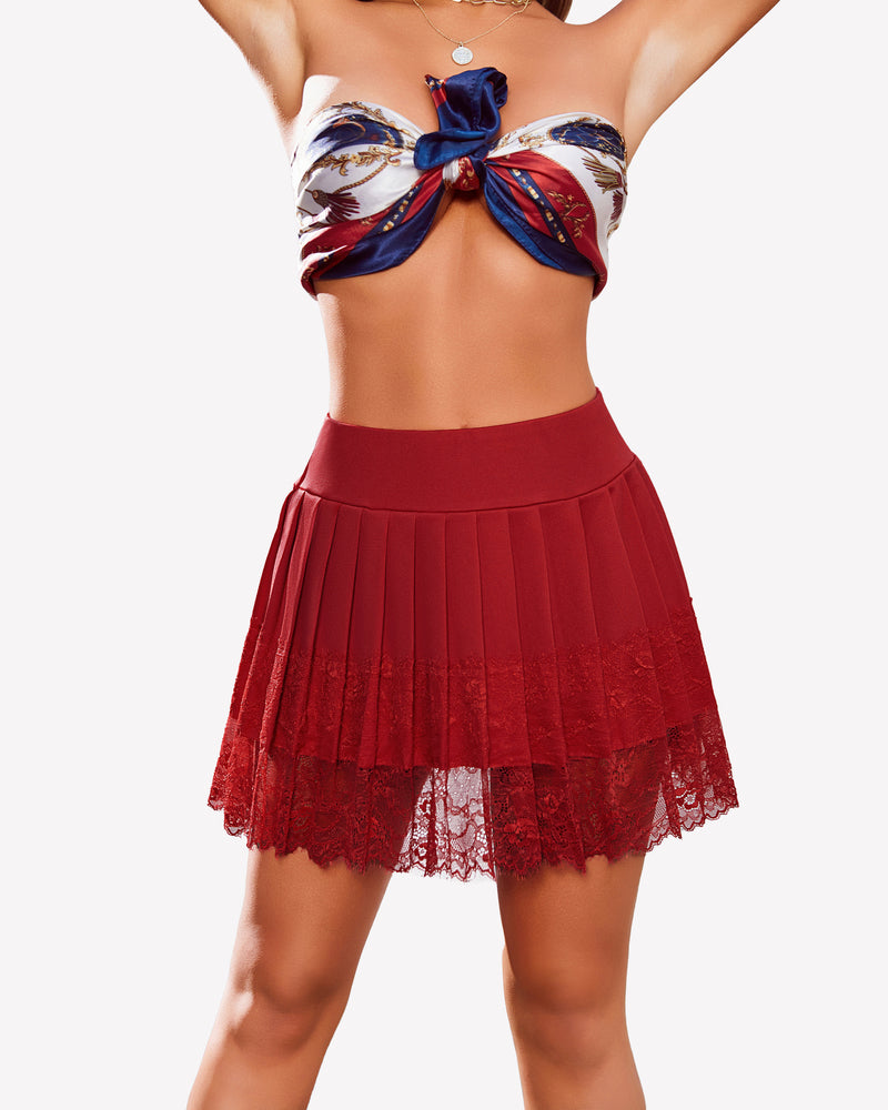 Burgundy pleated lace mini skirt with high waist and lace trim, paired with a scarf top, party wear.