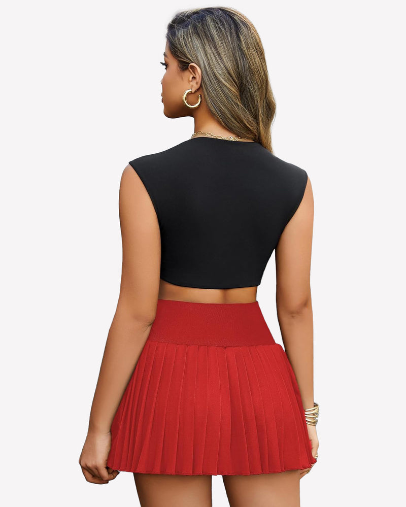 Red pleated mini skirt with black crop top. High-waisted design, perfect for confident style.