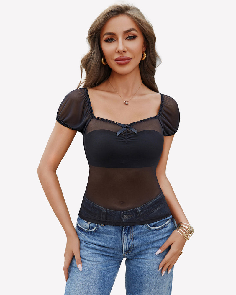 Black sheer mesh top with square neckline and bow detail, paired with blue jeans