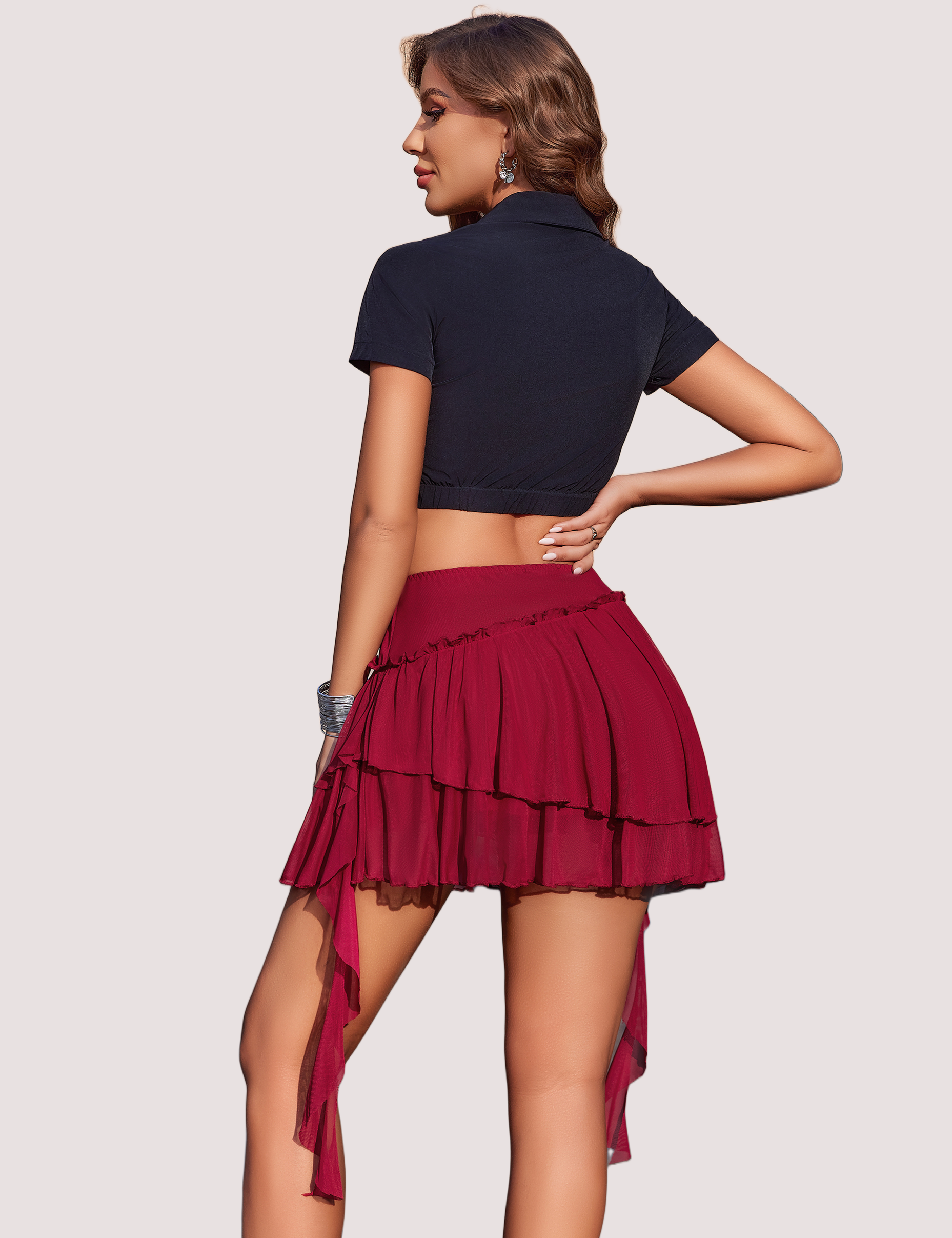 Burgundy ruffled mini skirt with mesh layers and flowy ribbons, confident and sexy look.