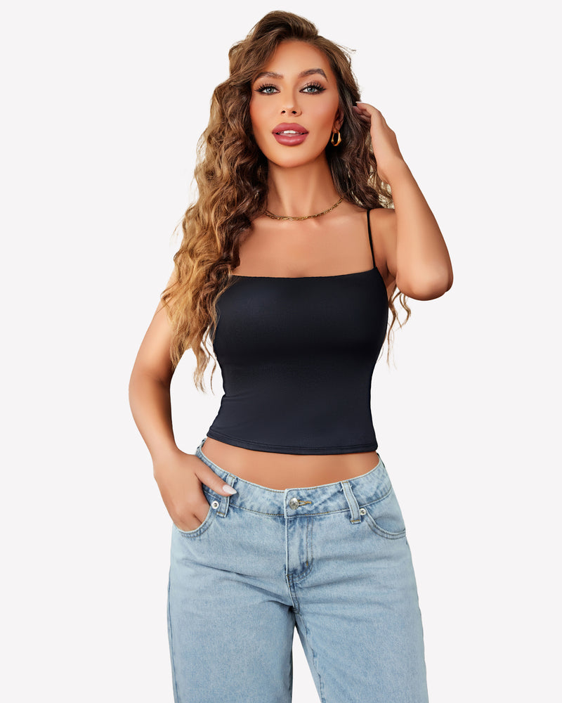Black cropped top with thin straps, backless design, paired with light blue jeans