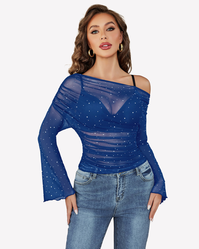 Blue mesh off-shoulder top with rhinestone accents, long bell sleeves, and jeans, a stylish look.