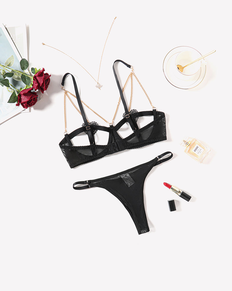 Black chain heart cutout lingerie set with gold chain details, perfect for romantic nights