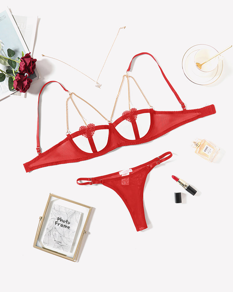 Red heart cutout lingerie set with chain details. Perfect for Valentine's or romantic nights.